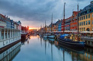 Coloured townhouses and wooden boats along the Nyhavn canal in Copenhagen