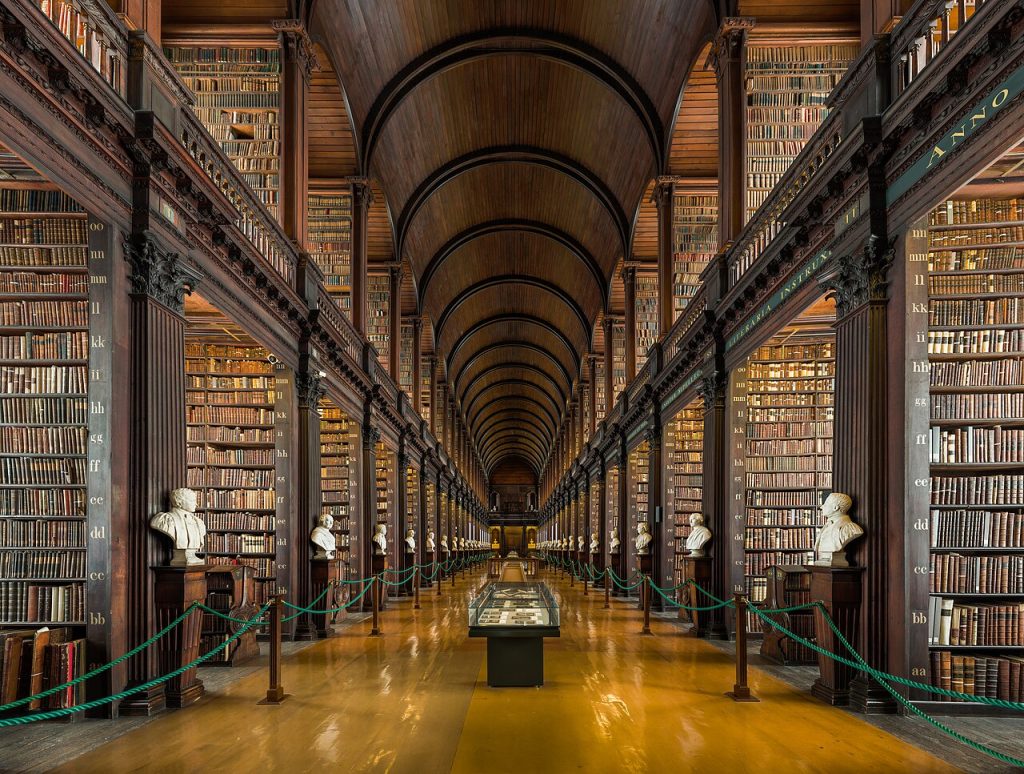 The barrel-vaulted Long Room library at Trinity College with its tiers of shelves and marble busts