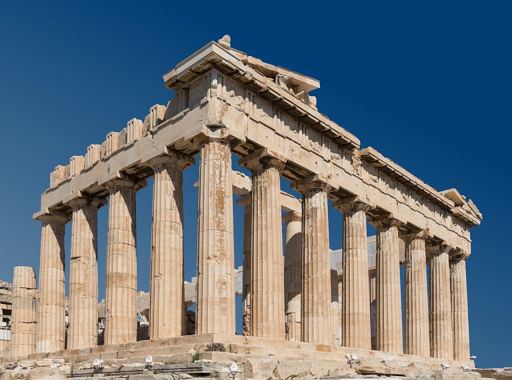 The Parthenon on the Acropolis, its columns and remaining pediment against a clear sky
