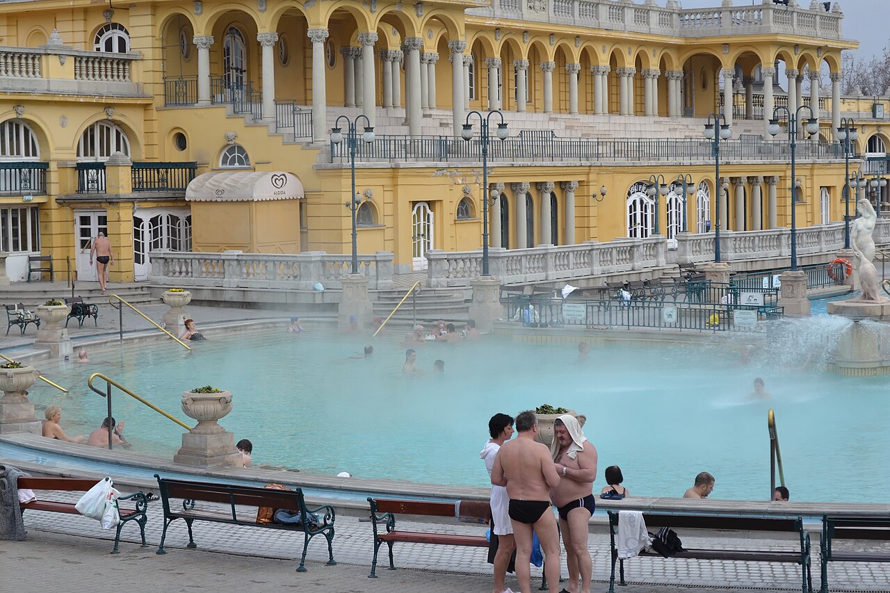 The yellow neo-baroque facades and outdoor thermal pools of the Szechenyi baths