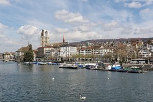 A wooden bathing pavilion built out over the green Limmat river in Zurich