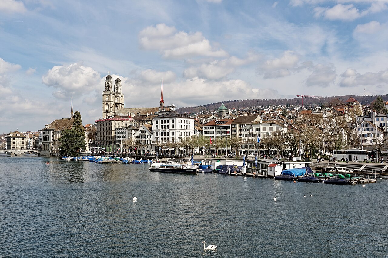 A wooden bathing pavilion built out over the green Limmat river in Zurich