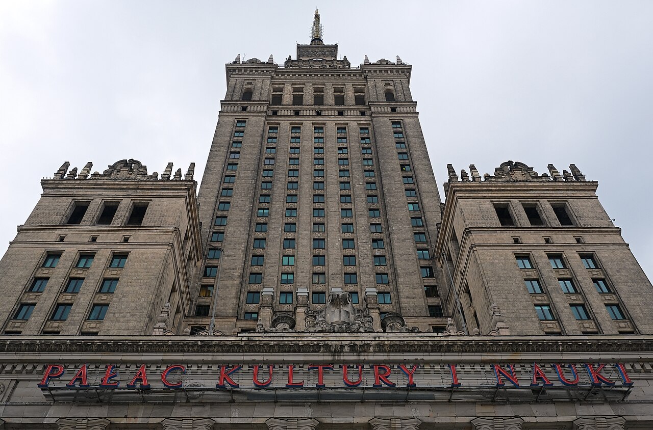 A tall stepped Stalinist skyscraper with a spire dominating the Warsaw skyline