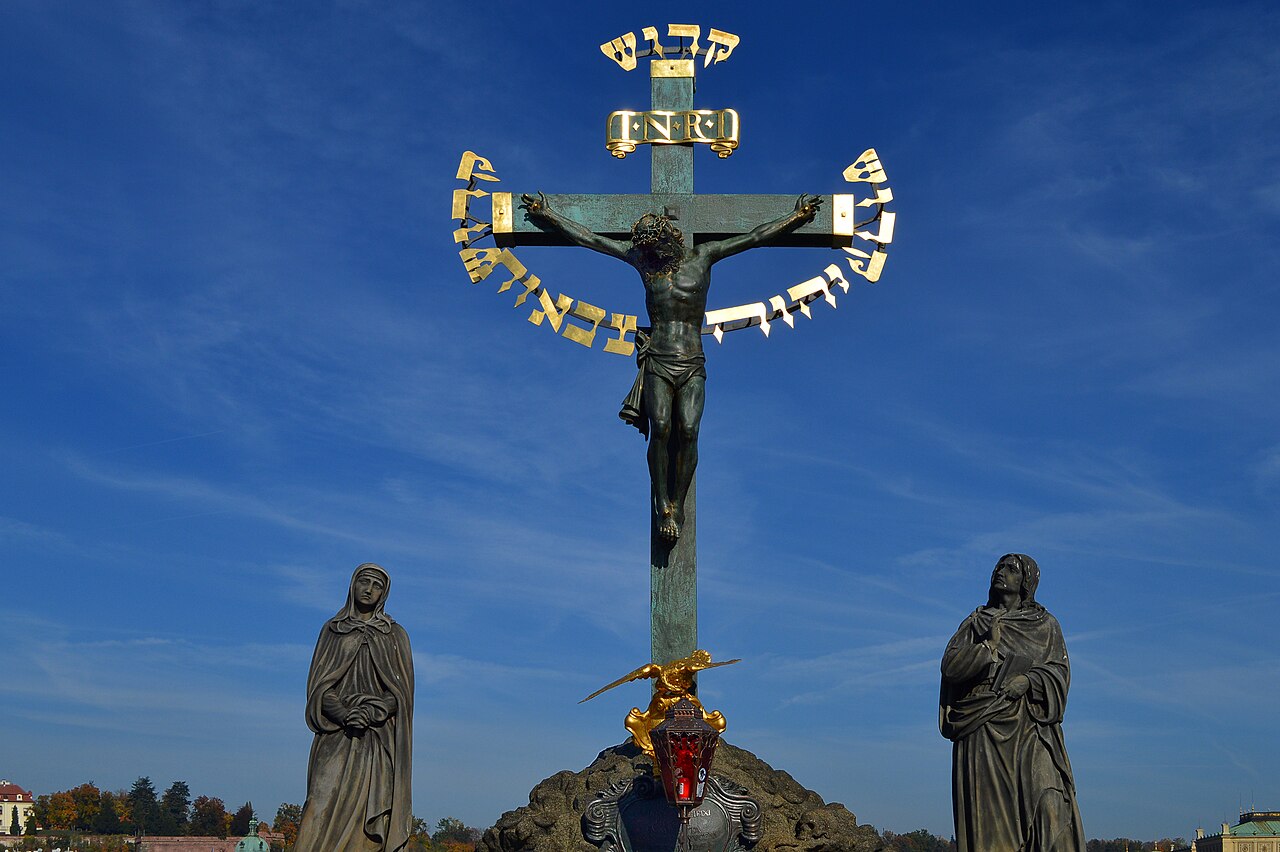 Charles Bridge over the Vltava with its baroque statues, the towers of the Old Town beyond