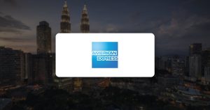 American Express logo over a city skyline at dusk
