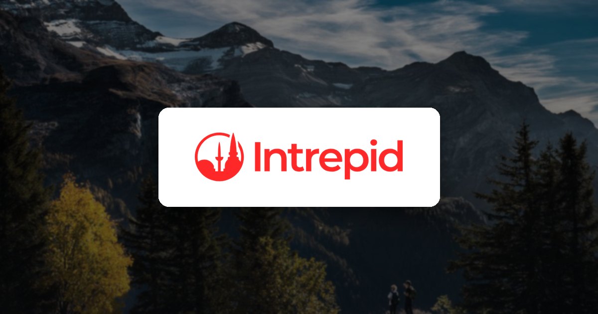 Intrepid Travel logo over a mountain range